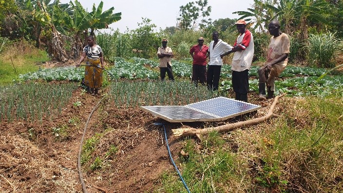 Small-scale farmer Patricia Zulu demonstrates the portable solar pump.